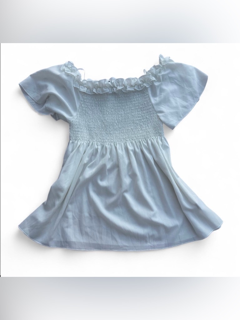 White Fashion Magazine Babydoll Blouse With Ruffled Neckline And Bust Smocking
